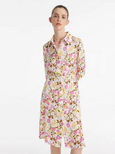 a lady in a mulberry silk floral printed midi dress with belt